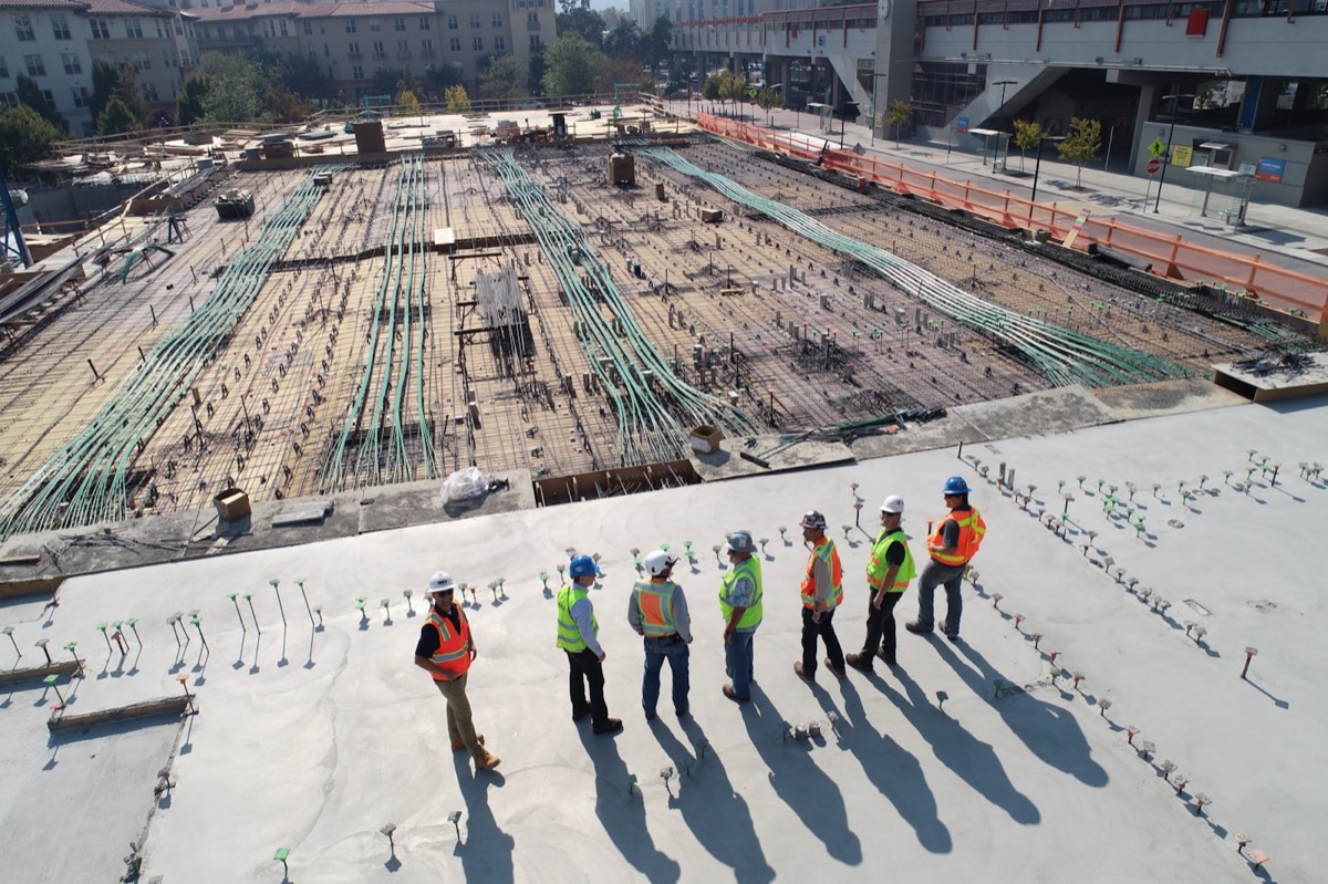 Construction crew framing the structural shell of a new build