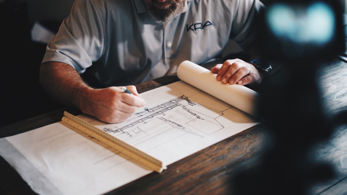 Oak and Iron craftsman finishing a custom timber and steel detail on a build